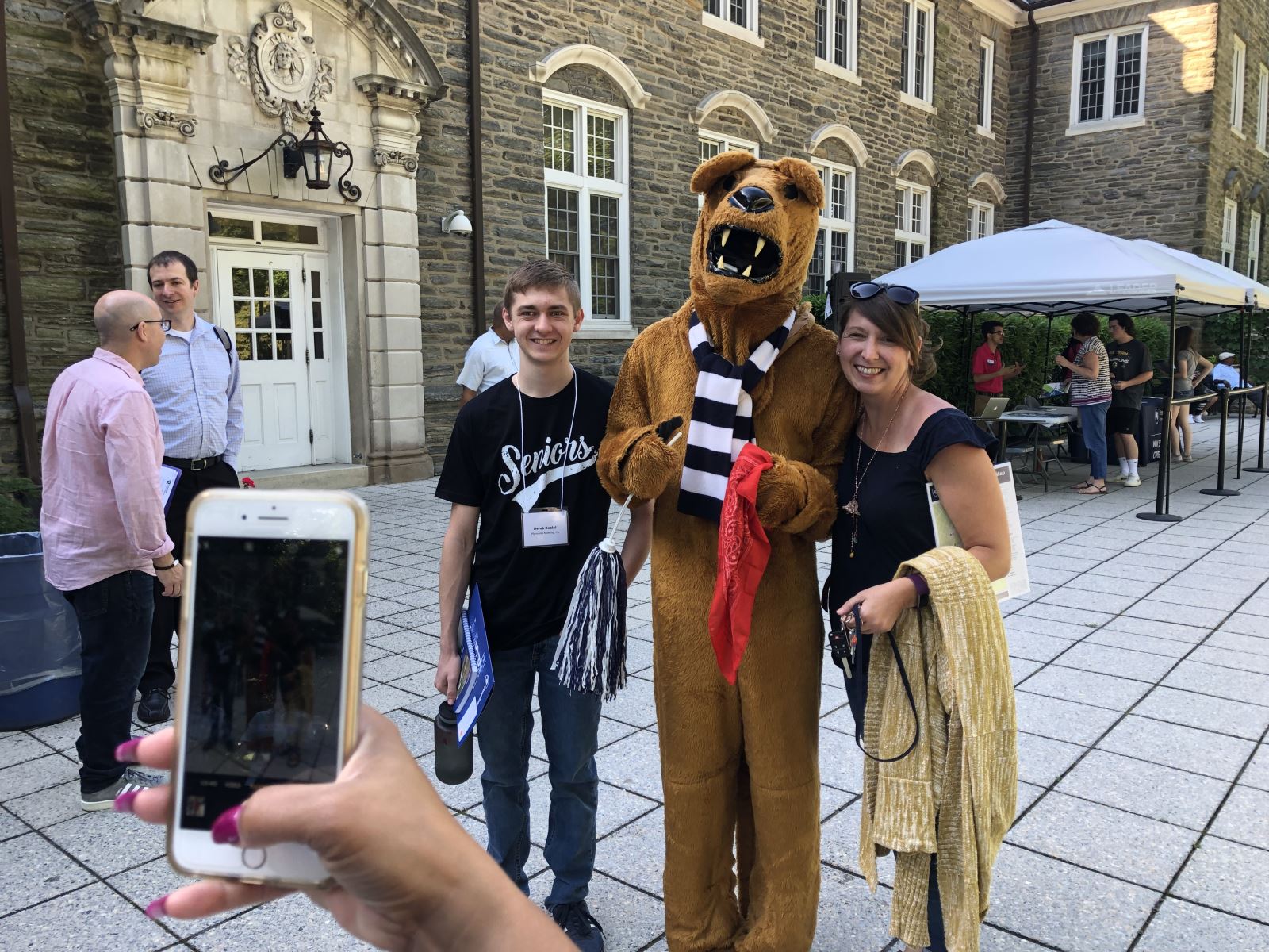 Family of Penn State Student taking photo with the Nittany Lion
