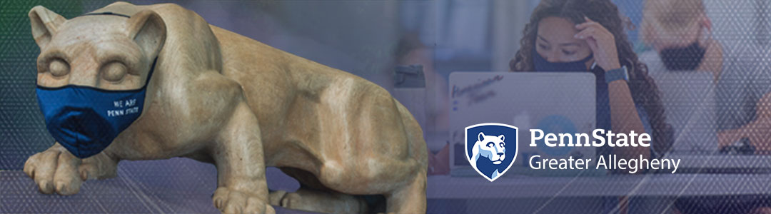 Penn State Greater Allegheny. Penn State Nittany Lion Shrine wearing protective mask. Masked Students in campus computer lab in background. 